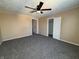 Bright bedroom featuring ceiling fan and ample closet space at 325 S Market St, Thorntown, IN 46071