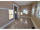 Empty dining room with light brown walls and wood-look flooring at 325 S Market St, Thorntown, IN 46071