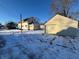 House exterior view with detached garage in winter setting at 325 S Market St, Thorntown, IN 46071
