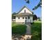 Charming two-story home with a grassy lawn and mature trees at 325 S Market St, Thorntown, IN 46071