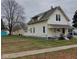 House exterior showcasing a side view and yard at 325 S Market St, Thorntown, IN 46071