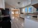 Eat-in kitchen with white cabinets and view of dining area at 325 S Market St, Thorntown, IN 46071