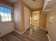 Functional laundry room with exterior access and wood-look floors at 325 S Market St, Thorntown, IN 46071