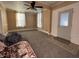 Spacious living room featuring gray carpeting and a view into another room at 325 S Market St, Thorntown, IN 46071