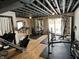 Home gym with various exercise equipment including a treadmill and weight bench at 3532 Soaring Eagle Ct, Indianapolis, IN 46214