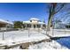 Front yard view of a charming house with snow on the ground at 3856 Hoyt Ave, Indianapolis, IN 46203