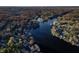 Aerial view of lakefront community with fall foliage at 387 W Roszell Dr, Nineveh, IN 46164