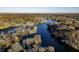 Wide aerial of lakefront community in autumn at 387 W Roszell Dr, Nineveh, IN 46164