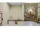 Basement bar with mini-fridge and stone feature wall at 387 W Roszell Dr, Nineveh, IN 46164