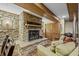 Spacious basement rec room with stone fireplace, pool table, and seating area at 387 W Roszell Dr, Nineveh, IN 46164