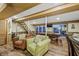 Relaxing basement rec room with pool table and view to backyard at 387 W Roszell Dr, Nineveh, IN 46164