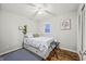 Bedroom with full-size bed, sunflower decor, and dark hardwood floors at 387 W Roszell Dr, Nineveh, IN 46164