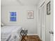 Cozy bedroom with striped bedding, wood floors, and built-in closet at 387 W Roszell Dr, Nineveh, IN 46164