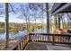 Spacious deck with lake views and wooden railings at 387 W Roszell Dr, Nineveh, IN 46164