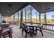 Spacious deck overlooking the lake with table and chairs for outdoor dining at 387 W Roszell Dr, Nineveh, IN 46164