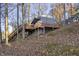 Lakefront home nestled on a hillside with a large deck at 387 W Roszell Dr, Nineveh, IN 46164