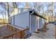 Lakefront home with wooden deck and surrounding trees at 387 W Roszell Dr, Nineveh, IN 46164