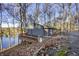 Lakefront home with a deck and wooded surroundings at 387 W Roszell Dr, Nineveh, IN 46164