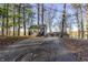 Lakefront property with a shed and a spacious driveway at 387 W Roszell Dr, Nineveh, IN 46164
