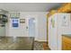 Kitchen with oak cabinets, side door, and stainless steel fridge at 387 W Roszell Dr, Nineveh, IN 46164