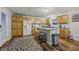 Bright kitchen with oak cabinets, island, and stainless steel appliances at 387 W Roszell Dr, Nineveh, IN 46164