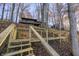 Steps leading to lakefront, wooden deck and stairs at 387 W Roszell Dr, Nineveh, IN 46164