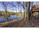 Lakefront deck with stairs, offering scenic lake views at 387 W Roszell Dr, Nineveh, IN 46164