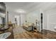 Cozy living room with hardwood floors and access to hallway and bathroom at 387 W Roszell Dr, Nineveh, IN 46164