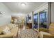 Open concept living room with kitchen, dining and access to deck at 387 W Roszell Dr, Nineveh, IN 46164
