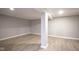 Finished basement offering a neutral color palette and wood-look floors at 4201 Westbourne Dr, Indianapolis, IN 46205