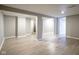 Large finished basement with multiple rooms and wood-look floors at 4201 Westbourne Dr, Indianapolis, IN 46205