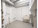 Unfinished basement laundry area with utility sink at 4201 Westbourne Dr, Indianapolis, IN 46205