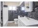 Clean bathroom with a modern vanity and dark marble-look walls at 4201 Westbourne Dr, Indianapolis, IN 46205