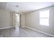 Spacious bedroom with wood-look floors and access to another room at 4201 Westbourne Dr, Indianapolis, IN 46205