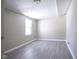 Simple bedroom with neutral walls and wood-look floors at 4201 Westbourne Dr, Indianapolis, IN 46205