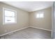Spacious bedroom with hardwood floors and two windows at 4201 Westbourne Dr, Indianapolis, IN 46205