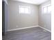 Bright bedroom with hardwood floors and large windows at 4201 Westbourne Dr, Indianapolis, IN 46205