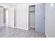 Bright bedroom with wood-look floors and ample closet space at 4201 Westbourne Dr, Indianapolis, IN 46205