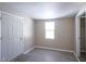 Well-lit bedroom featuring wood-look floors and a closet at 4201 Westbourne Dr, Indianapolis, IN 46205