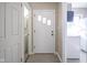 Interior entryway with white door and laminate flooring at 4201 Westbourne Dr, Indianapolis, IN 46205