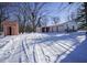 House exterior with two-car garage and shed in winter setting at 4201 Westbourne Dr, Indianapolis, IN 46205