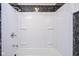 Updated shower with white walls and black and white accents at 4201 Westbourne Dr, Indianapolis, IN 46205