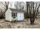 Useful storage shed with double doors, window, and stone bench at 441 W Main St, Carmel, IN 46032