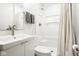 Clean bathroom with white vanity, shower, and toilet at 500 W 93Rd St, Indianapolis, IN 46260