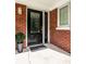 Black front door with glass panels and a mat at 500 W 93Rd St, Indianapolis, IN 46260