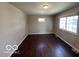A bedroom featuring laminate floors and windows at 529 S Kiel Ave, Indianapolis, IN 46241