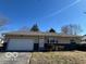 Charming single-story home with a two-car garage and well-maintained landscaping at 529 S Kiel Ave, Indianapolis, IN 46241