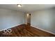 An open-concept living room featuring hardwood floors at 529 S Kiel Ave, Indianapolis, IN 46241