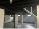 Unfinished basement with high ceilings and ample storage space at 555 N Oakland Ave, Indianapolis, IN 46201
