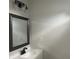 Modern bathroom with white vanity and gray framed mirror at 555 N Oakland Ave, Indianapolis, IN 46201